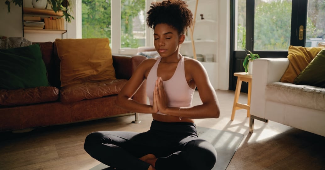 Woman meditating at home