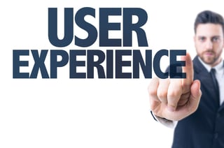 Business man pointing the text User Experience.jpeg
