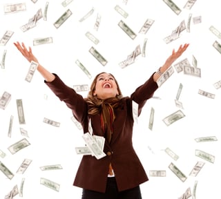 Business woman under a money rain - isolated over a white background.jpeg
