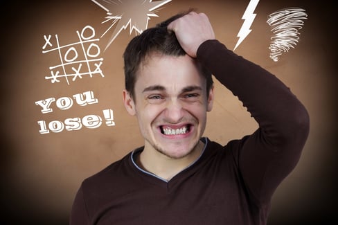 Closeup portrait goofy, funny face, young man slapping hand on head, upset he lost game isolated brown background tic tac toe. Negative human emotion facial expression feelings, body language reaction