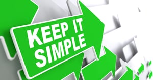 Keep it Simple on Direction Sign - Green Arrow on a Grey Background.