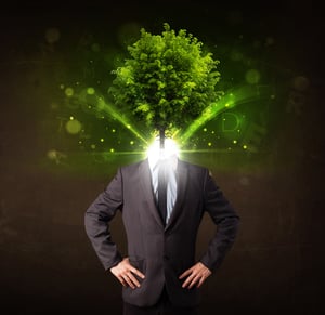 Man with green tree head concept on brown background