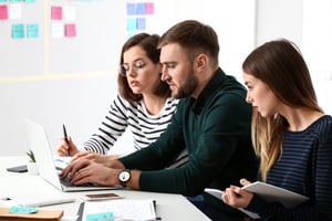 Group of 3 Employees Working Together