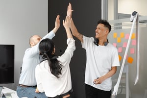 Group of Employees Giving High-Five