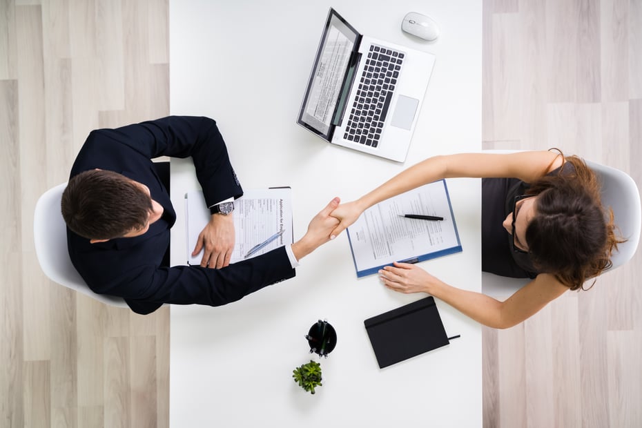 Workers shaking hands