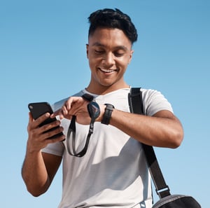 Person Glancing Down at Smart Watch