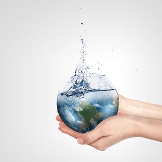 Globe in human hand against blue sky. Environmental protection concept. Elements of this image furnished by NASA.jpeg