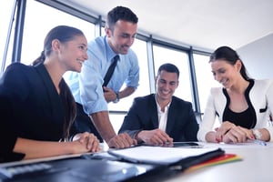 Group of happy young  business people in a meeting at office