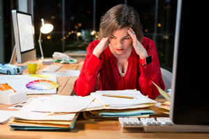 Stressed businesswoman sitting in front of computer in the office-2