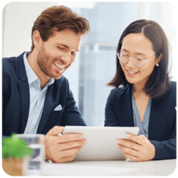 Two Co-Workers Collaborating with Tablet