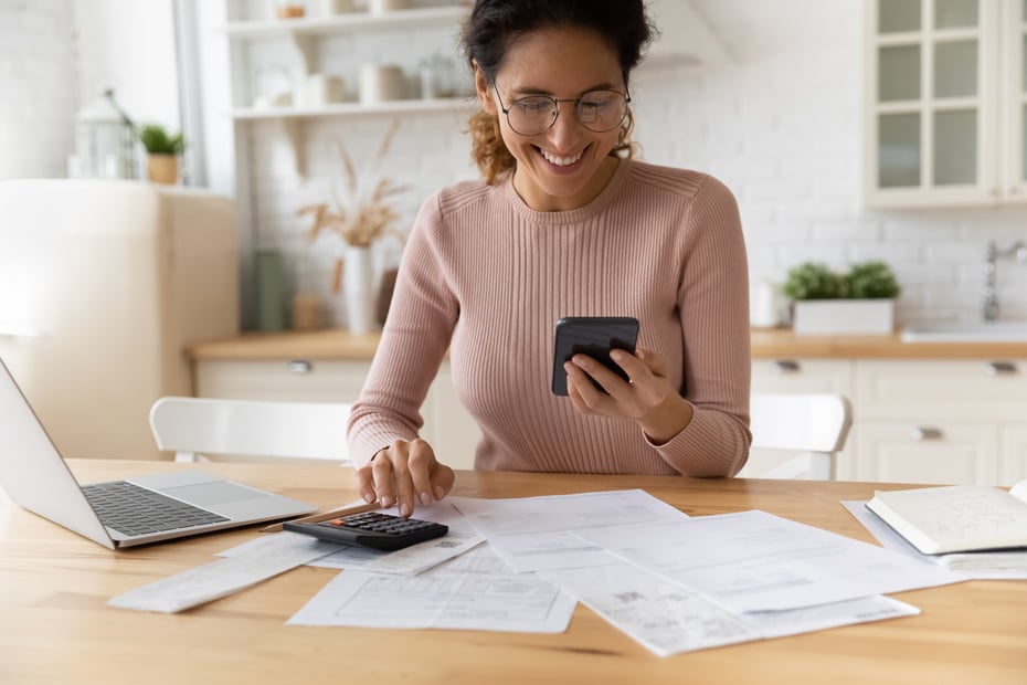 Woman on phone doing personal finances