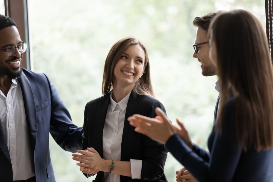 Woman smiling at colleagues 