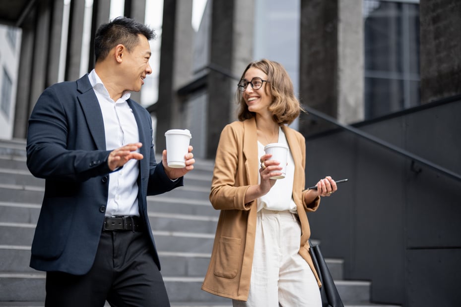 Two colleagues walking outside