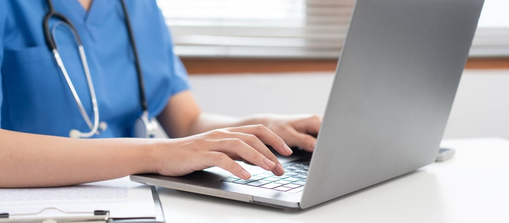 Nurse working at a computer