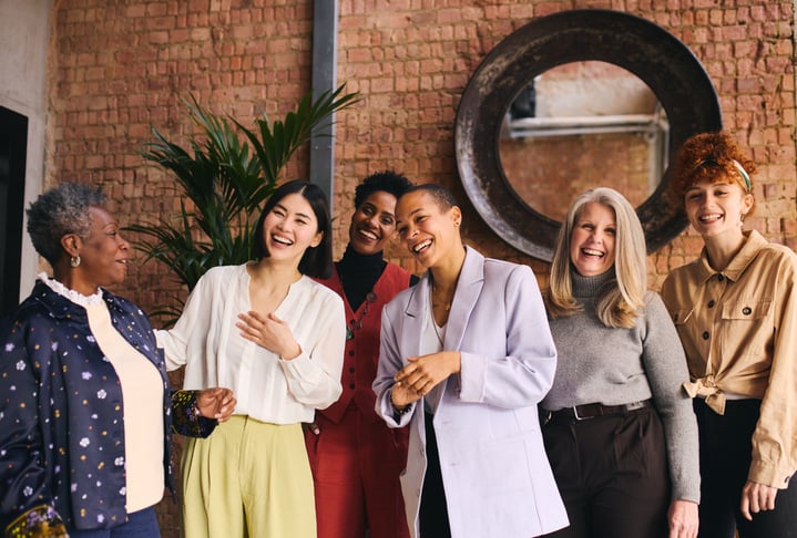 multiethnic women laughing in a group