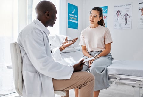 Woman speaking to doctor