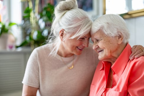 middle aged woman caregiving senior