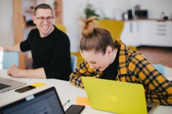 duo laughing at work