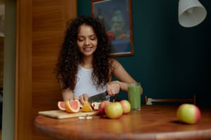 woman cutting fruit