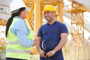 2 construction workers talking