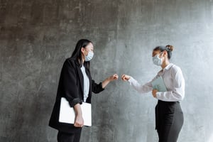 two people in facemasks