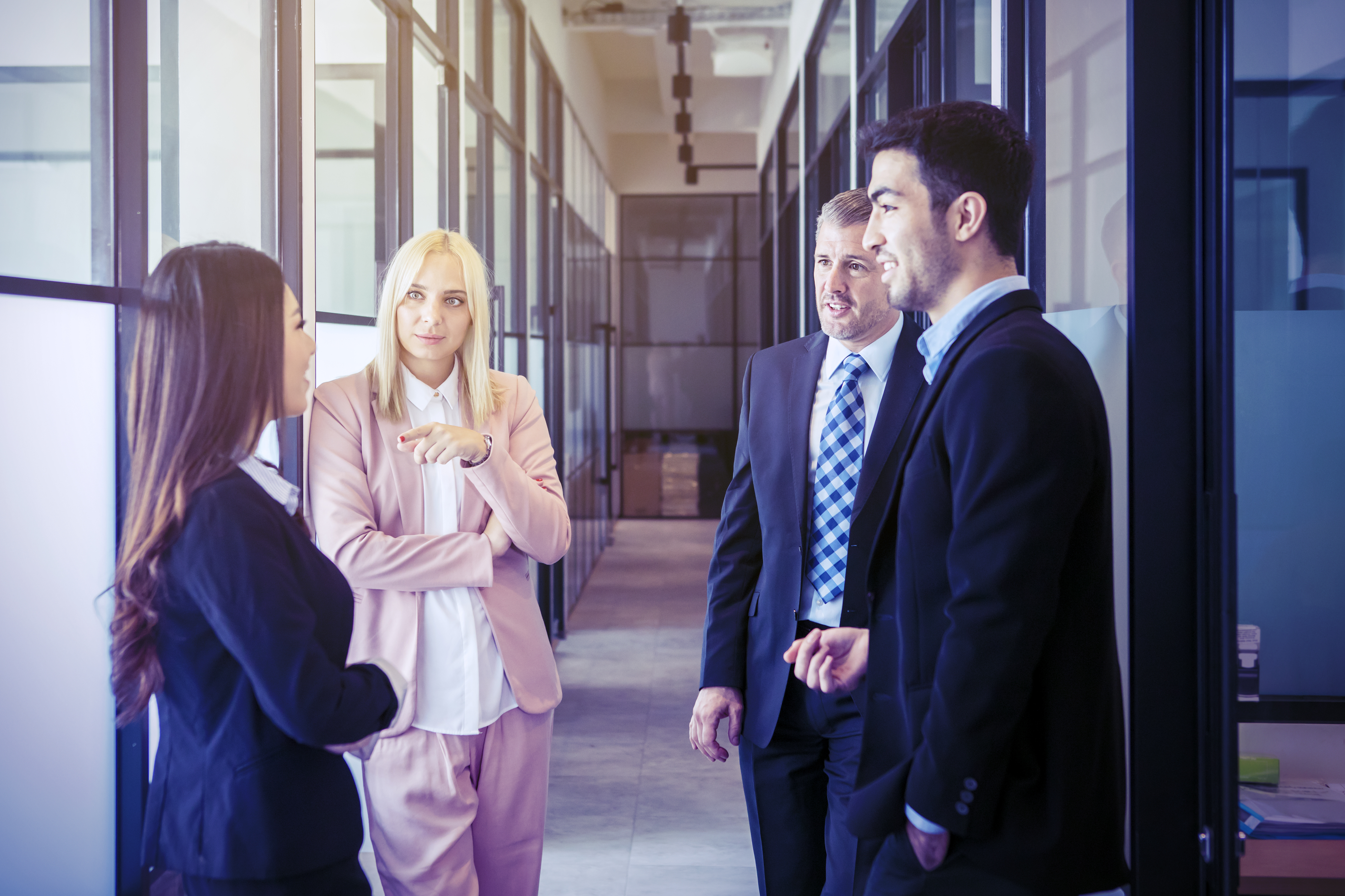 group of employees gathering in hallway